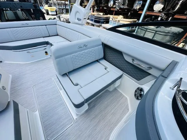 Slide: The Image of 2024 Sea Ray 270 SDX boat interior with luxurious seating and modern design. - 19