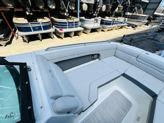 Slide: The Image of 2024 Sea Ray 270 SDX boat interior with spacious seating and modern design. - 25