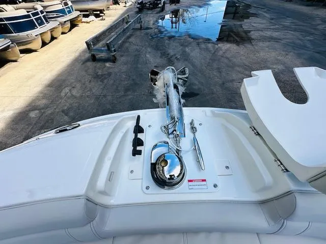Slide: The Image of 2024 Sea Ray 270 SDX boat deck with anchor and storage compartments. - 26