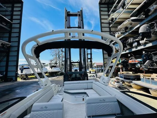 Slide: The Image of 2024 Sea Ray 270 SDX boat in storage facility with forklift. - 27