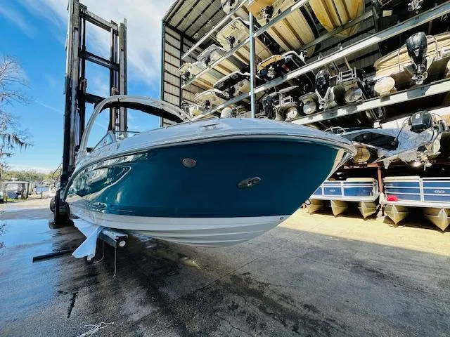 Slide: The Image of 2024 Sea Ray 270 SDX boat in storage facility. - 4