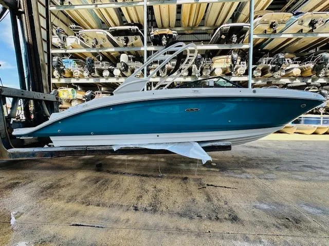 Slide: The Image of 2024 Sea Ray 270 SDX boat in storage facility. - 5