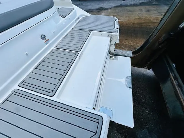 Slide: The Image of 2024 Sea Ray 270 SDX swim platform with integrated ladder. - 9
