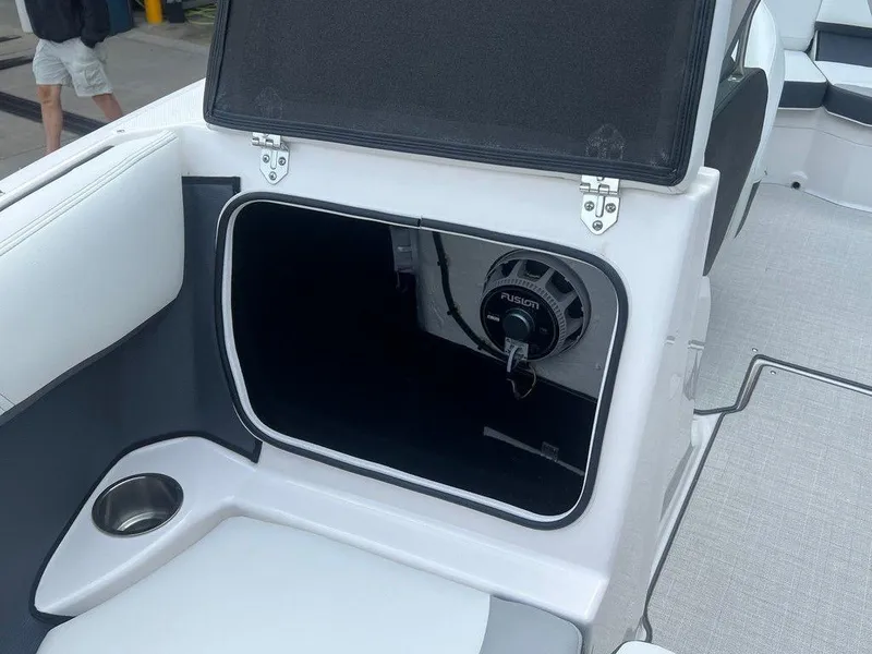 Slide: The Image of 2024 Regal 2000 ES boat storage compartment with Fusion speaker. - 11