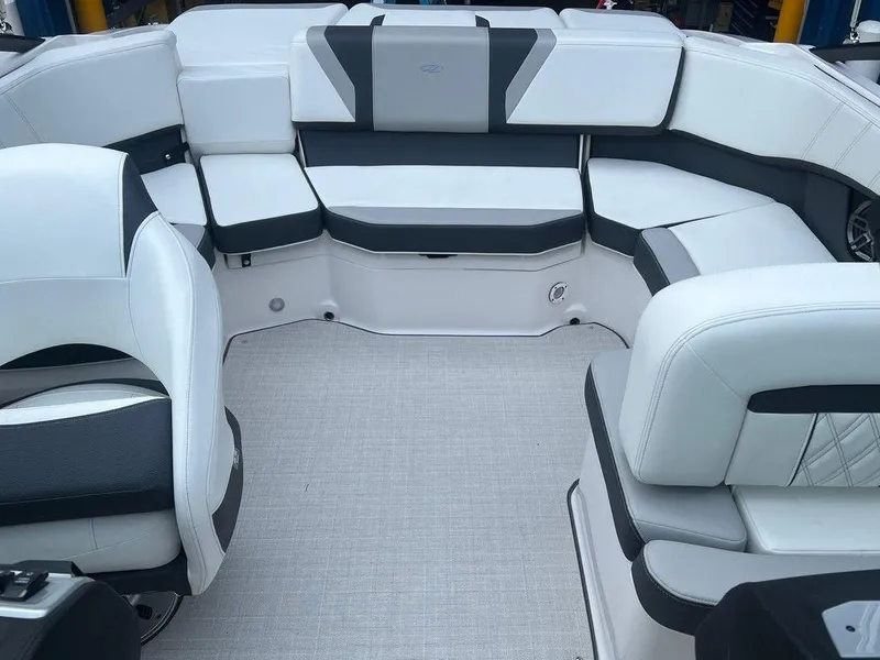 Slide: The Image of 2024 Regal 2000 ES boat interior with white and gray seating. - 13