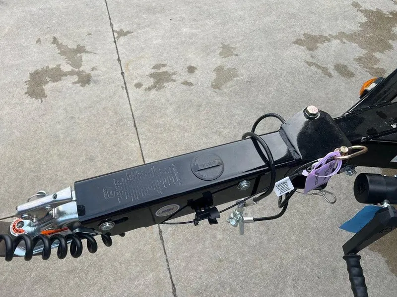 Slide: The Image of Close-up of 2024 Regal 2000 ES trailer hitch on concrete surface. - 2