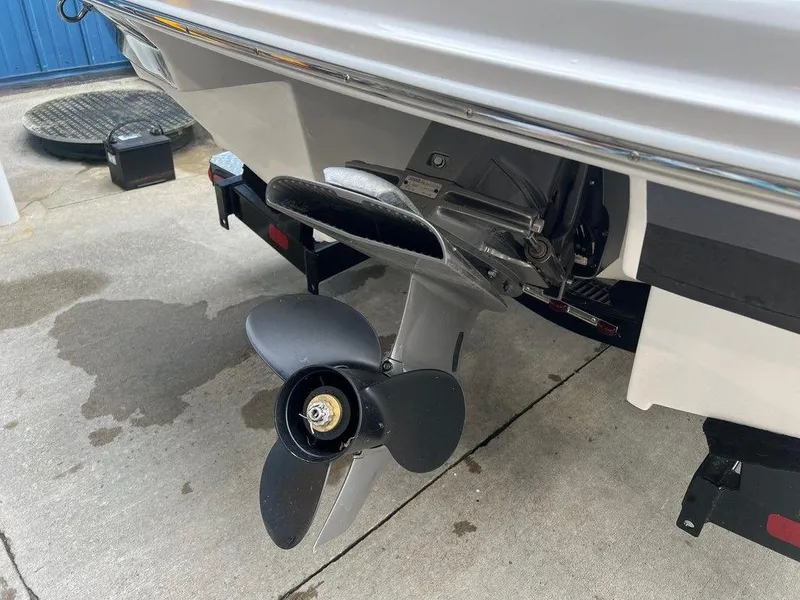 Slide: The Image of 2024 Regal 2000 ES boat stern with propeller and outboard motor. - 4