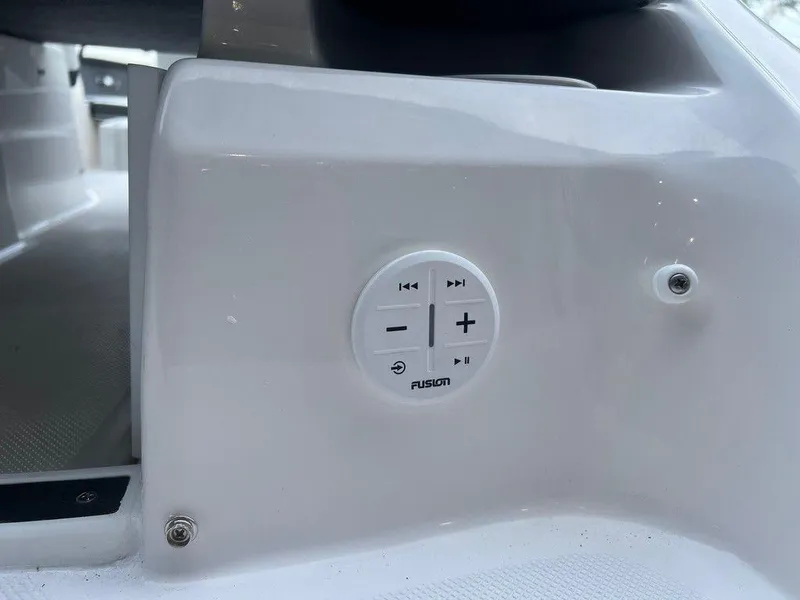 Slide: The Image of Close-up of 2024 Regal 2000 ES boat's Fusion audio control panel. - 5