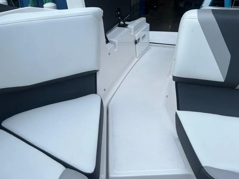 Slide: The Image of 2024 Regal 2000 ES boat interior with white and gray seating. - 6