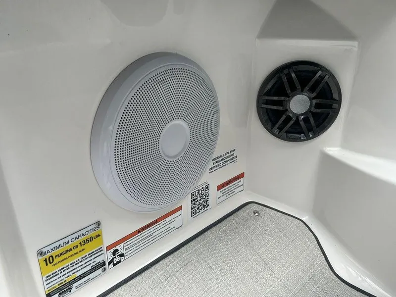 Slide: The Image of 2024 Regal 2000 ES boat interior speakers and capacity labels. - 7