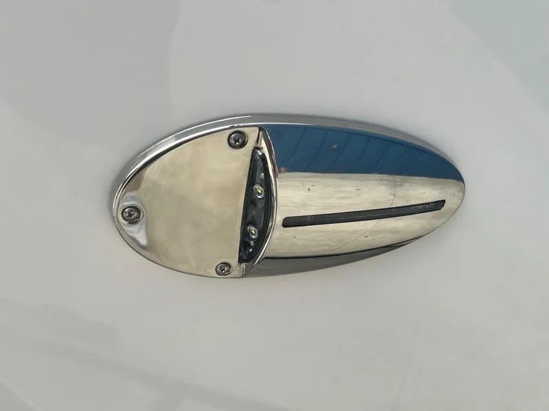 Slide: The Image of Close-up of a 2024 Regal LX4 boat's chrome exhaust vent. - 15