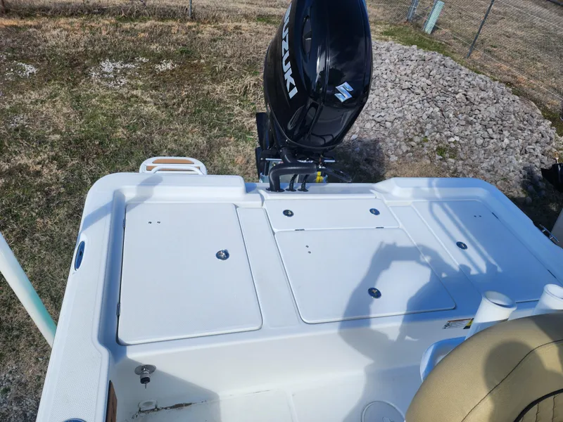 Slide: The Image of 2024 Savannah 220 IS boat with Suzuki outboard motor, rear deck view. - 18