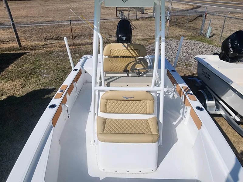 Slide: The Image of 2024 Savannah 220 IS boat with tan seating and white frame. - 21