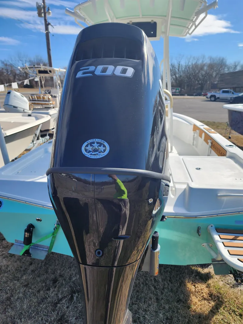 Slide: The Image of 2024 Savannah 220 IS boat with a 200 HP outboard motor. - 9