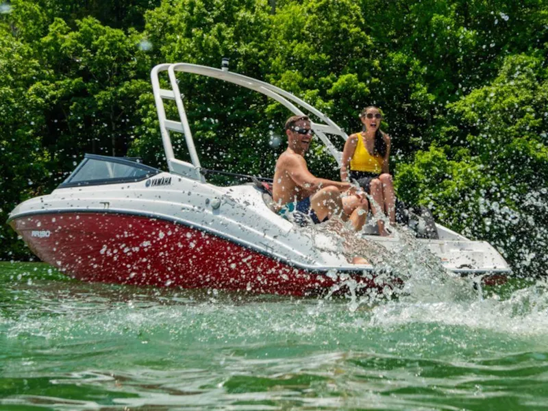 The Image of 2024 Yamaha Boats SX190 on water with two people enjoying the ride. - 1