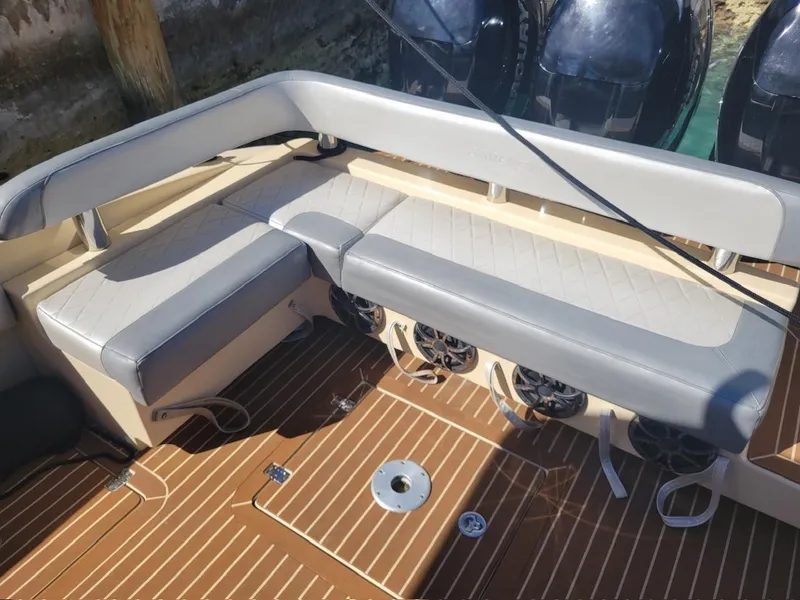Slide: The Image of 2013 Statement 38 SUV Open boat seating area with speakers and teak flooring. - 10