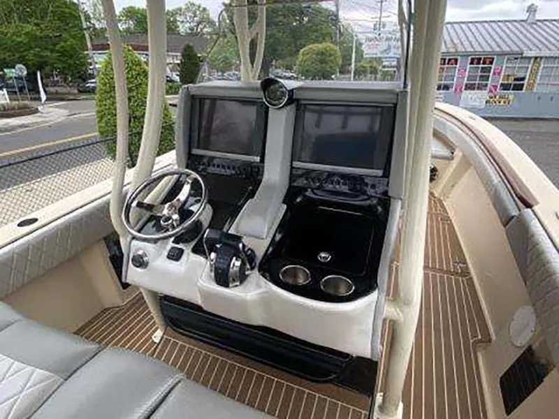 Slide: The Image of 2013 Statement 38 SUV Open boat cockpit with dual screens and steering wheel. - 6