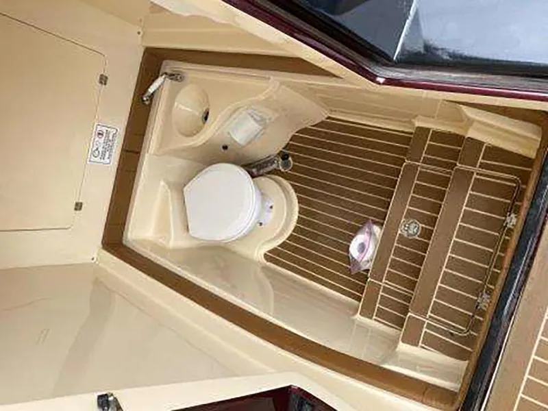 Slide: The Image of 2013 Statement 38 SUV Open boat bathroom interior with toilet and sink - 8