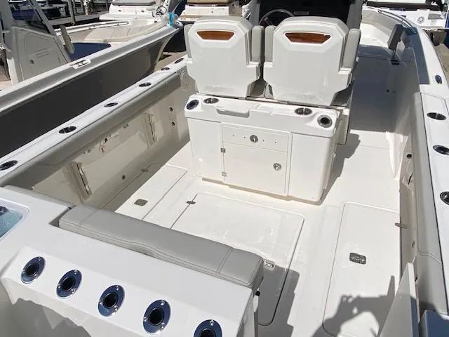 Slide: The Image of 2024 Pursuit S 268 boat interior with seating and storage compartments. - 10