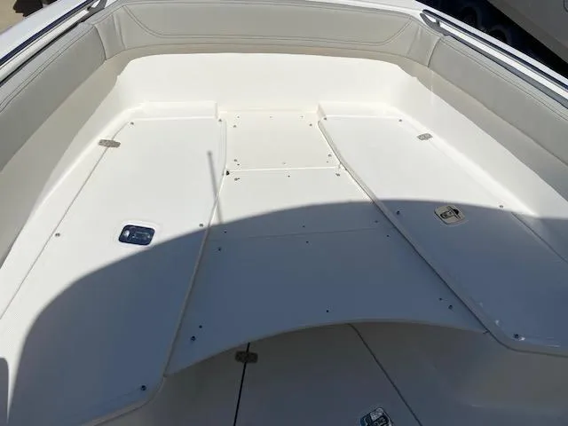 Slide: The Image of 2024 Pursuit S 268 boat interior, spacious seating and storage area. - 20