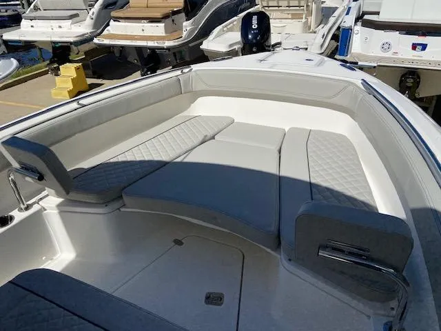 Slide: The Image of 2024 Pursuit S 268 boat with spacious seating area and modern design. - 23