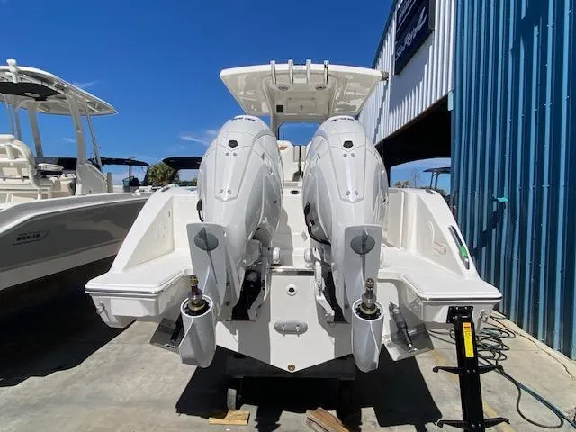 Slide: The Image of 2024 Pursuit S 268 boat with twin outboard engines, rear view. - 6