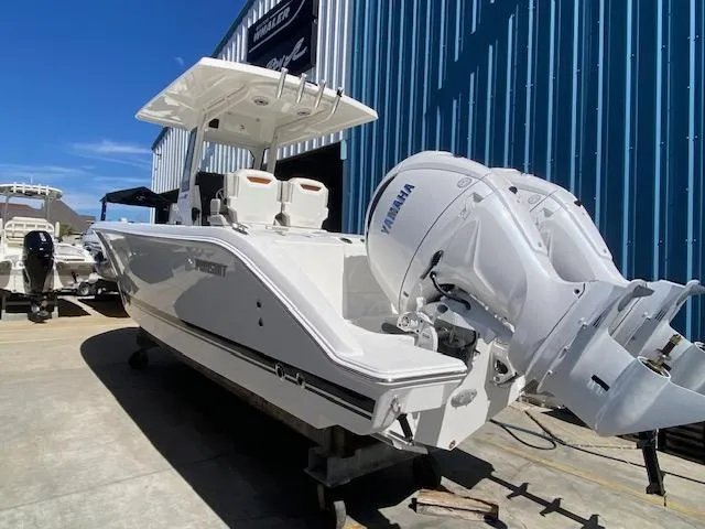 Slide: The Image of 2024 Pursuit S 268 boat with Yamaha outboard motor in marina. - 7