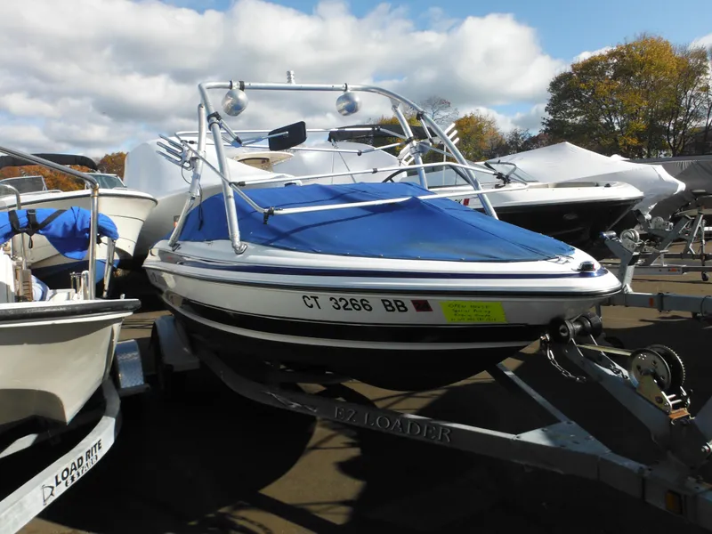 Slide: The Image of 2006 Larson SEi 180 Sport I/O boat on trailer with blue cover. - 14