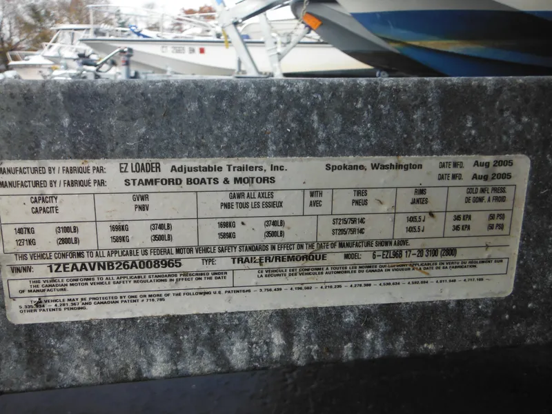 Slide: The Image of 2006 Larson SEi 180 Sport I/O boat trailer label by EZ Loader, Stamford Boats & Motors. - 2