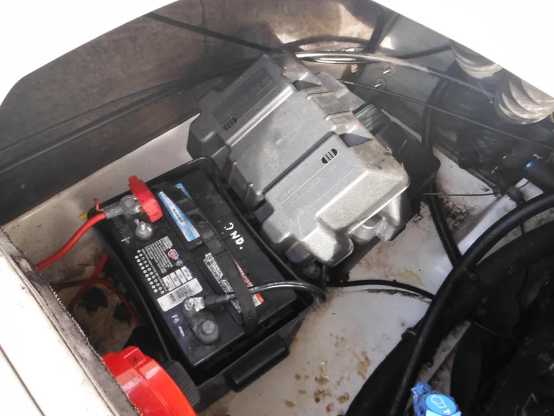 Slide: The Image of Battery compartment of a 2006 Larson SEi 180 Sport I/O boat. - 34