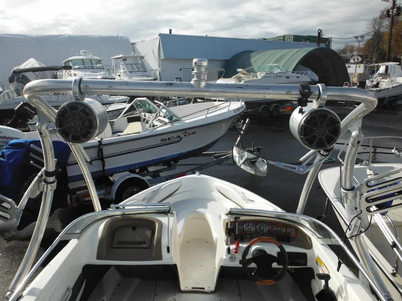 Slide: The Image of 2006 Larson SEi 180 Sport I/O boat interior with wakeboard tower and speakers. - 38
