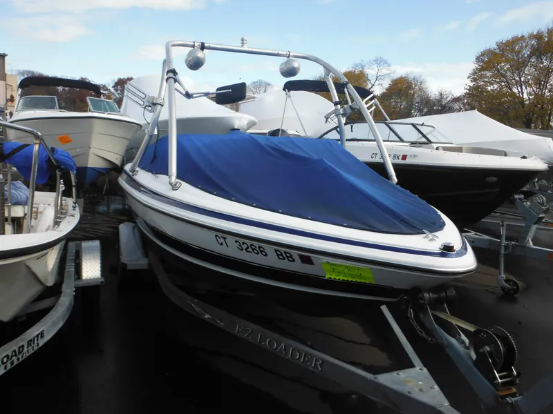 Slide: The Image of 2006 Larson SEi 180 Sport I/O boat on trailer with blue cover. - 4