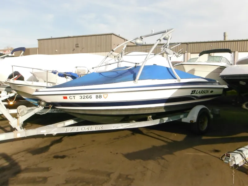 Slide: The Image of 2006 Larson SEi 180 Sport I/O boat on a trailer in a storage yard. - 45