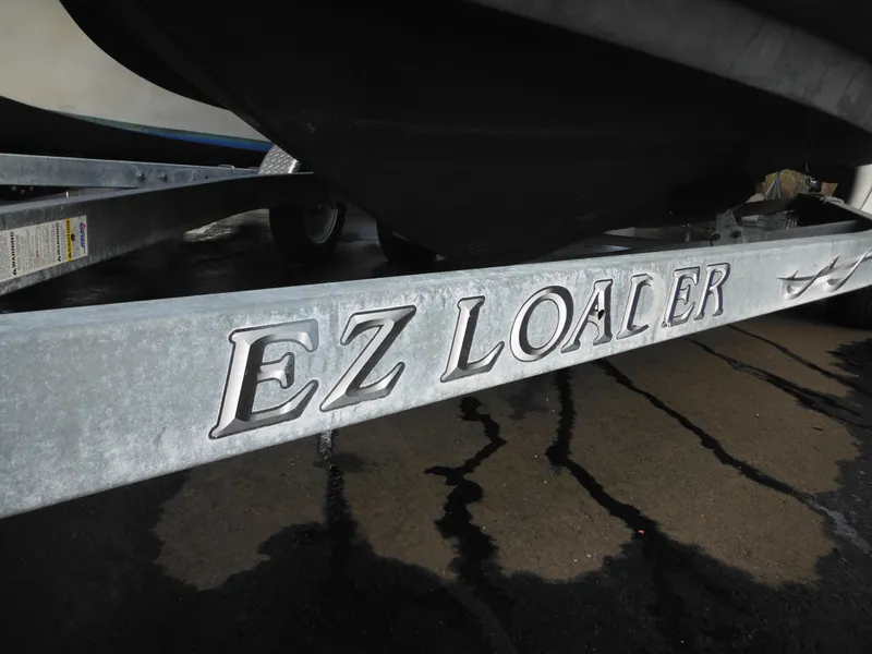 Slide: The Image of EZ Loader trailer for 2006 Larson SEi 180 Sport I/O boat. - 5