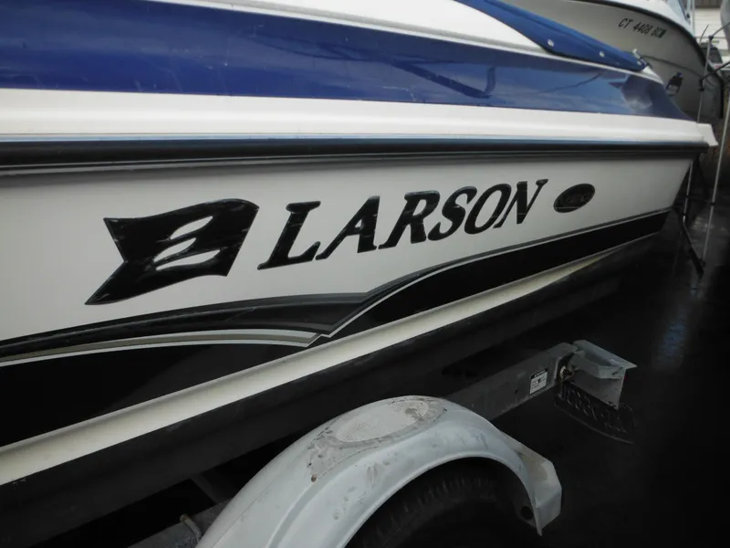 Slide: The Image of 2006 Larson SEi 180 Sport I/O boat side view on trailer. - 6