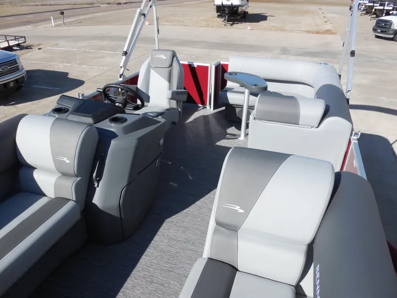 Slide: The Image of 2024 Bennington 188 SVL pontoon boat interior with gray and red seating. - 5