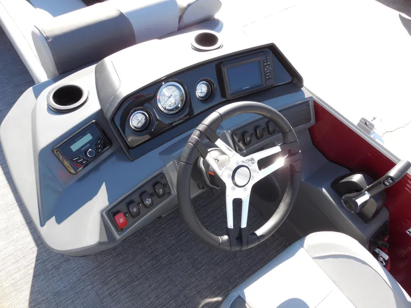 Slide: The Image of 2024 Bennington 188 SVL boat dashboard with steering wheel and control panel. - 7