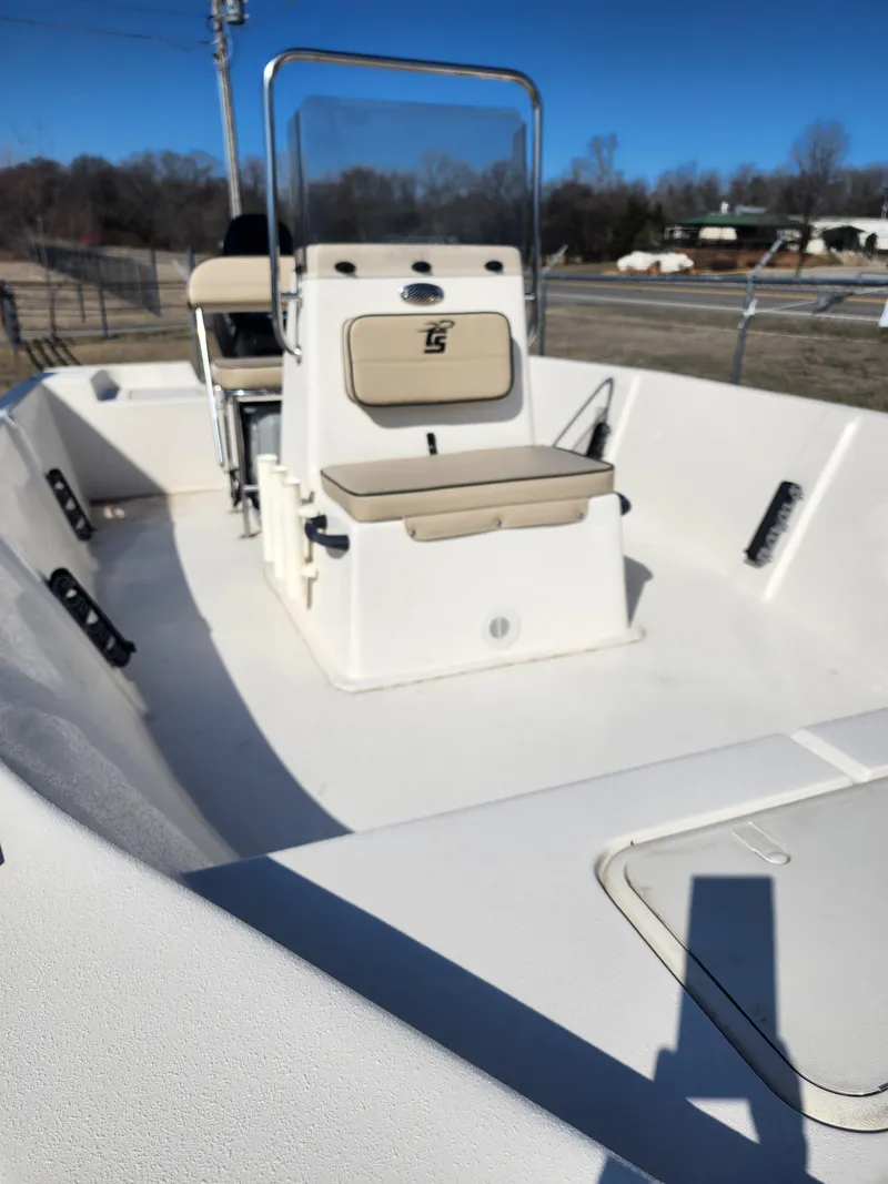 Slide: The Image of 2024 Carolina Skiff EV180 Sea Skiff boat interior with console and seating. - 11