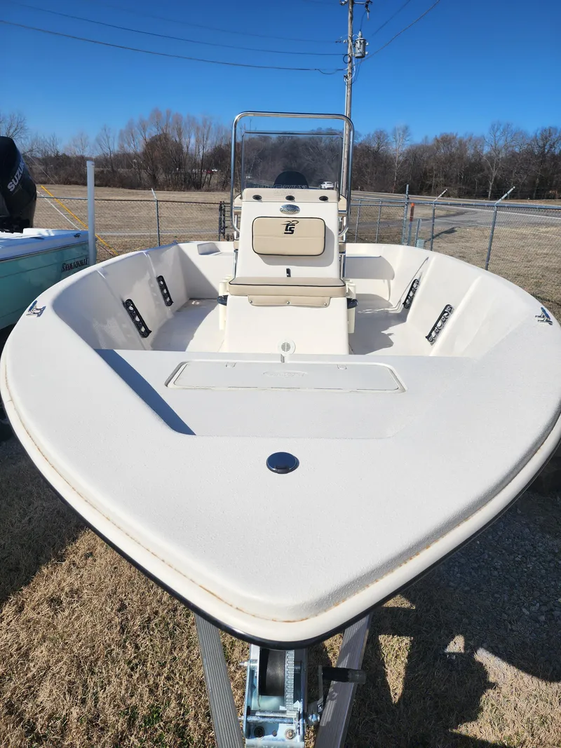 Slide: The Image of 2024 Carolina Skiff EV180 Sea Skiff boat on display outdoors. - 12