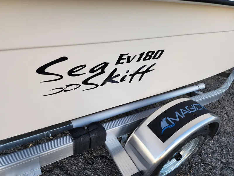 Slide: The Image of 2024 Carolina Skiff EV180 Sea Skiff on trailer, close-up view. - 13