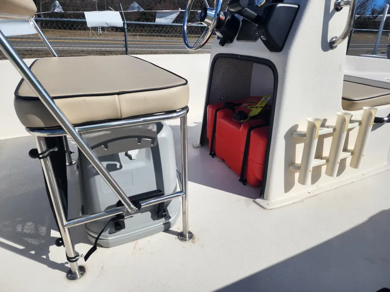 Slide: The Image of 2024 Carolina Skiff EV180 Sea Skiff interior with storage and seating. - 6