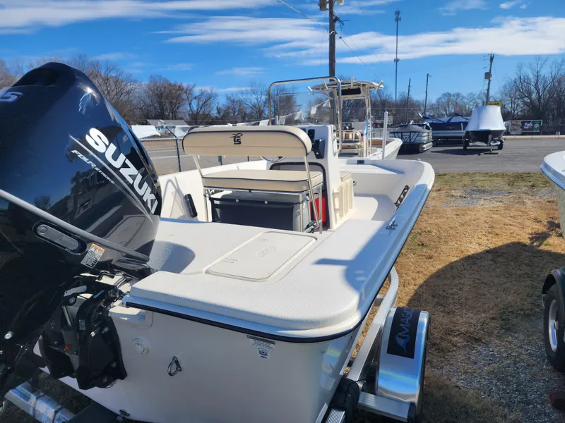 Slide: The Image of 2024 Carolina Skiff EV180 Sea Skiff with Suzuki outboard motor on display. - 8