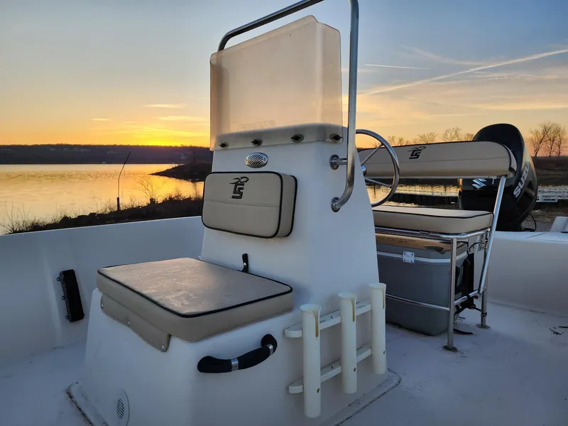 Slide: The Image of 2024 Carolina Skiff EV180 Sea Skiff at sunset by a serene lake. - 9