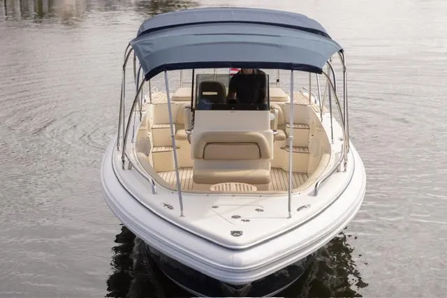 Slide: The Image of 2007 Novurania Chase boat with canopy on calm water. - 4