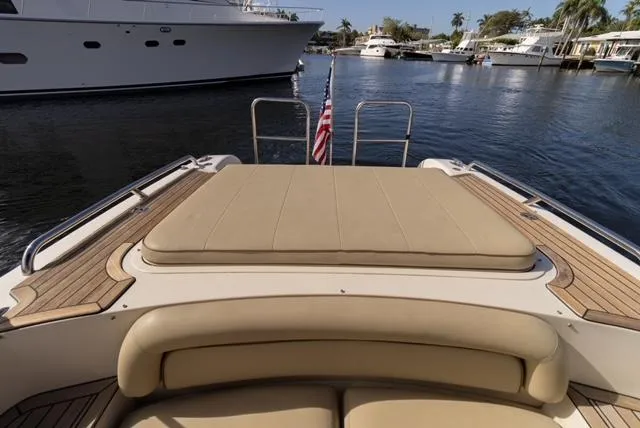 Slide: The Image of 2007 Novurania Chase boat with cushioned deck, docked in a marina. - 7