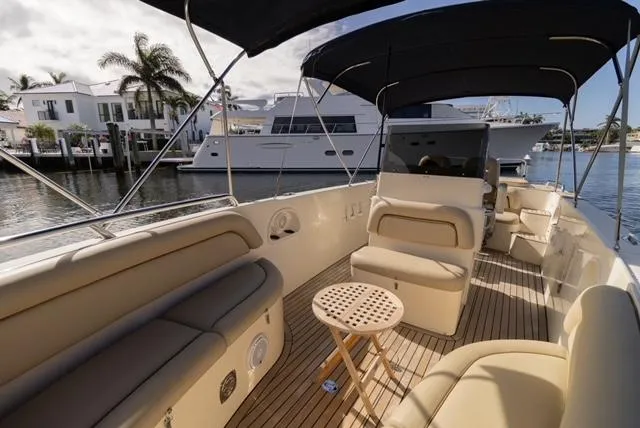 Slide: The Image of 2007 Novurania Chase boat interior with beige seating and wooden deck. - 9