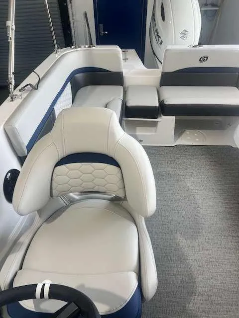 Slide: The Image of 2024 Hurricane 218 SS boat interior with white and blue seating. - 10