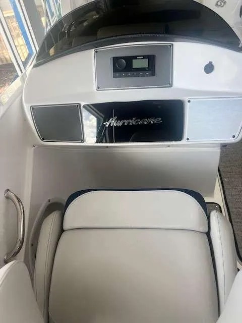 Slide: The Image of 2024 Hurricane 218 SS boat interior with dashboard and seating. - 11