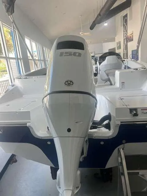 Slide: The Image of 2024 Hurricane 218 SS boat with 150 HP outboard motor in showroom. - 3