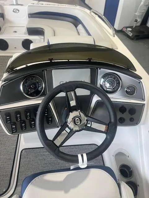 Slide: The Image of 2024 Hurricane 218 SS boat dashboard with steering wheel and control panel. - 5